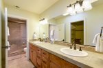 Master bathroom offers double sinks, a walk in closet, and shower